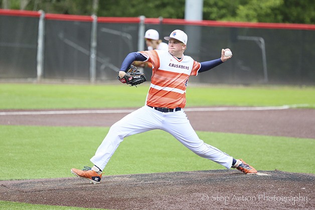 Eastside Catholic Crusaders pitcher Cole Galvagno unleashes a pitch toward the plate against the Sumner Spartans in the first round of the Class 3A state tournament on May 22 at Bannerwood Park in Bellevue.