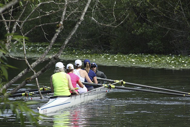 A group of rowers makes a practice run before the regional championships.