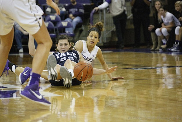 University of Washington Huskies freshman basketball player Mackenzie Wieburg dives for a loose ball in the second half of a contest against Yale on Nov. 23 in Seattle.