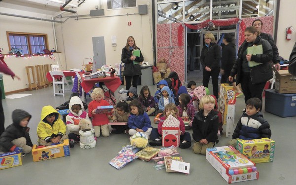 Pre-schoolers from Evergreen Academy in Issaquah brought toys to donate to the Issaquah Food and Clothing Bank’s Caring through Sharing event.