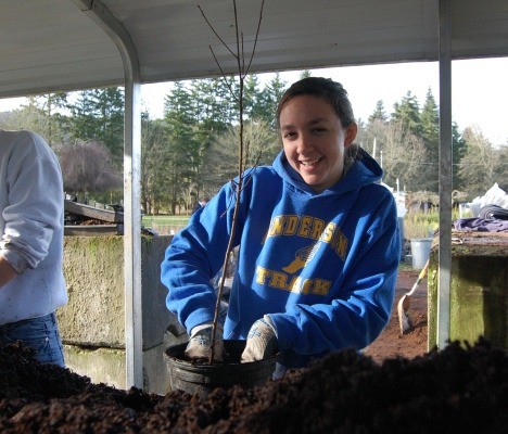 University of Washington freshman Alexandra Colley was happy to get her hands dirty for the Mountains to Sound Greenway on Martin Luther King Jr. Day