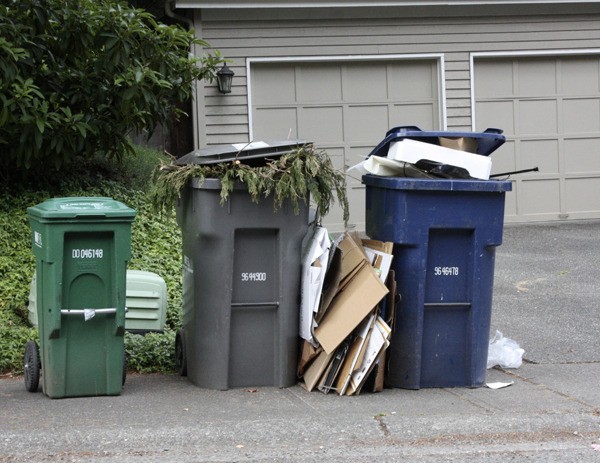 These recycling and yard waste cans in north Sammamish were starting to overflow after a week of not receiving service. Waste Management collectors ended their strike Wednesday night after reaching an agreement with their company.