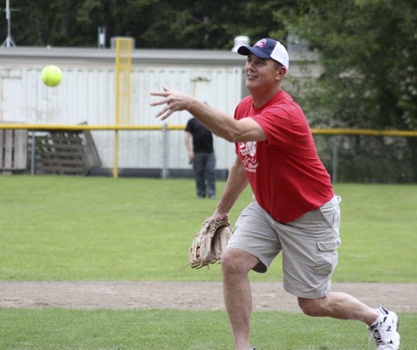 Dave O'Connor delivers a pitch to home plate during the ninth annual Brock O'Connor Memorial Softball game on Saturday.