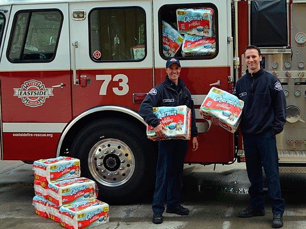 A little relief Captain Ben Lane (left) and firefighter Dave Rudd show some of the 960 rolls of Charmin toilet paper delivered to Eastside Fire and Rescue as part of the Charmin Relief Project. The company donated a year's worth of toilet paper for 20 firemen as part of a nationwide donation to one fire house in every state. Charmin recently asked consumers to share stories via Facebook and Twitter of firehouses in their communities that were experiencing sub-par bathroom conditions and in need of relief. The brand then picked one in each state that could use the extra support. Charmin is a division of Procter & Gamble.