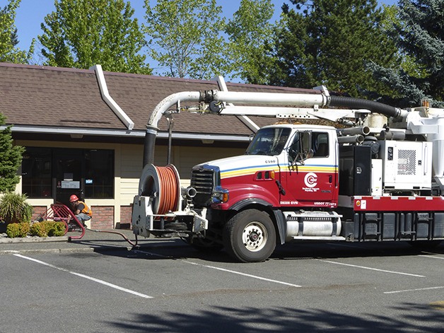 An employee with Flohawks Plumbing and Septic works on a main sewer line break at the McDonald’s restaurant at 1305 N.E. Gilman Blvd. in Issaquah. The problem caused raw sewage to back up into the kitchen.