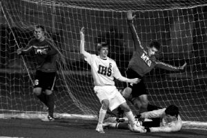 Issaquah’s Jeffrey Hjort looks to the sideline official to see if a goal was scored Tuesday night. The ball