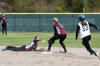 Eastlake shortstop Stephanie Fox flips the ball to second baseman Heather Hammack for an out in the sixth inning of Tuesday’s game. The play saved a Redmond run from scoring.
