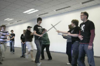 Cast members rehearse their play of “Prince Caspian.”