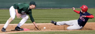 Eastlake shortstop Michael Russo attempts to lay a tag on a Juanita runner Monday afternoon.
