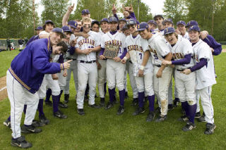 The Issaquah baseball team poses with its KingCo 3A tournament championship trophy after beating Liberty 10-9 Saturday at Bannerwood Park in Bellevue.