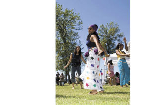 Woman at the Sundiata Festival at Lake Sammamish State Park dance to the rhythm of the music by the Adrian Xavier Group. The festival happened on June 28 and celebrated African-American culture and features games