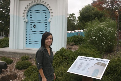 Iman Belali stands in front of the symbol of Issaquah's sister-city relationship with Chefchaouen