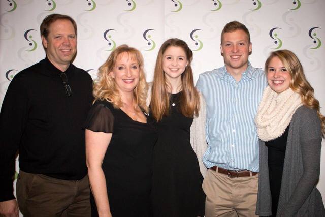 SAMMI recipient Julie Siefkes (second from left) and her family. Siefkes was honored for her work in helping local students and families in need. Photo courtesy of SAMMI Awards Foundation