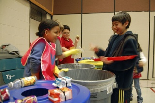 Jessica Donaldson and Sergio Palomino share a laugh after lunch as they contribute to Challenger Elementary's Waste Watchers program.