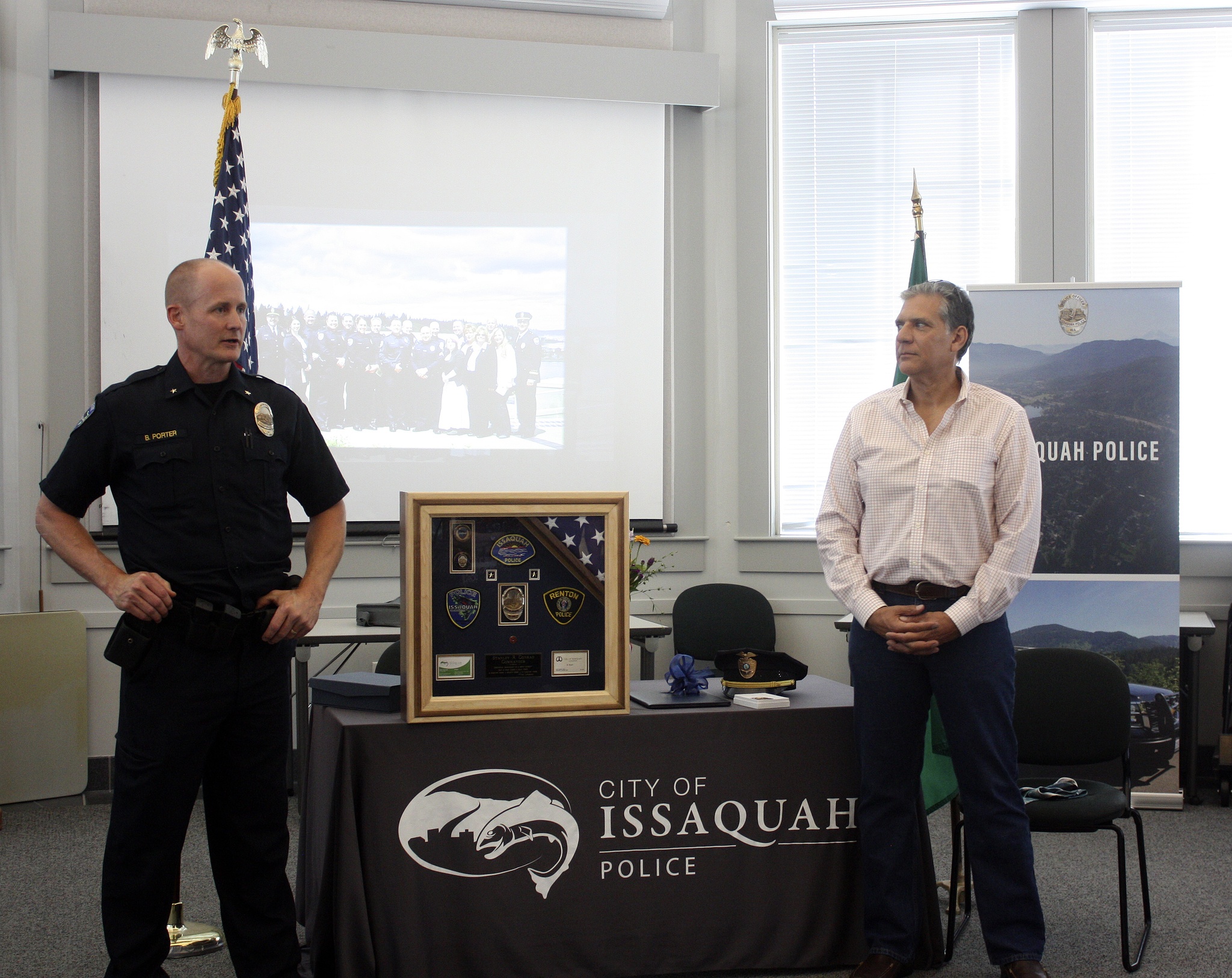 Nicole Jennings/staff photo.  Police shared anecdotes from Conrad's time in Issaquah along with words of appreciation for his dedicated work. Conrad was presented with different keepsakes