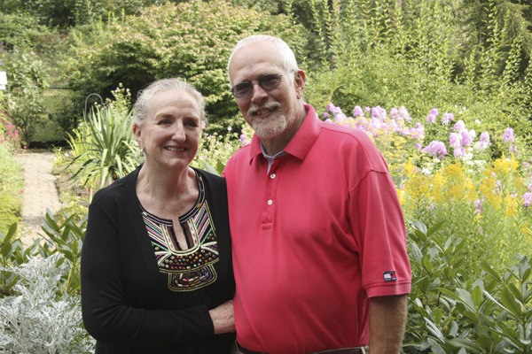 Donna and Rick Cooke stand in their garden
