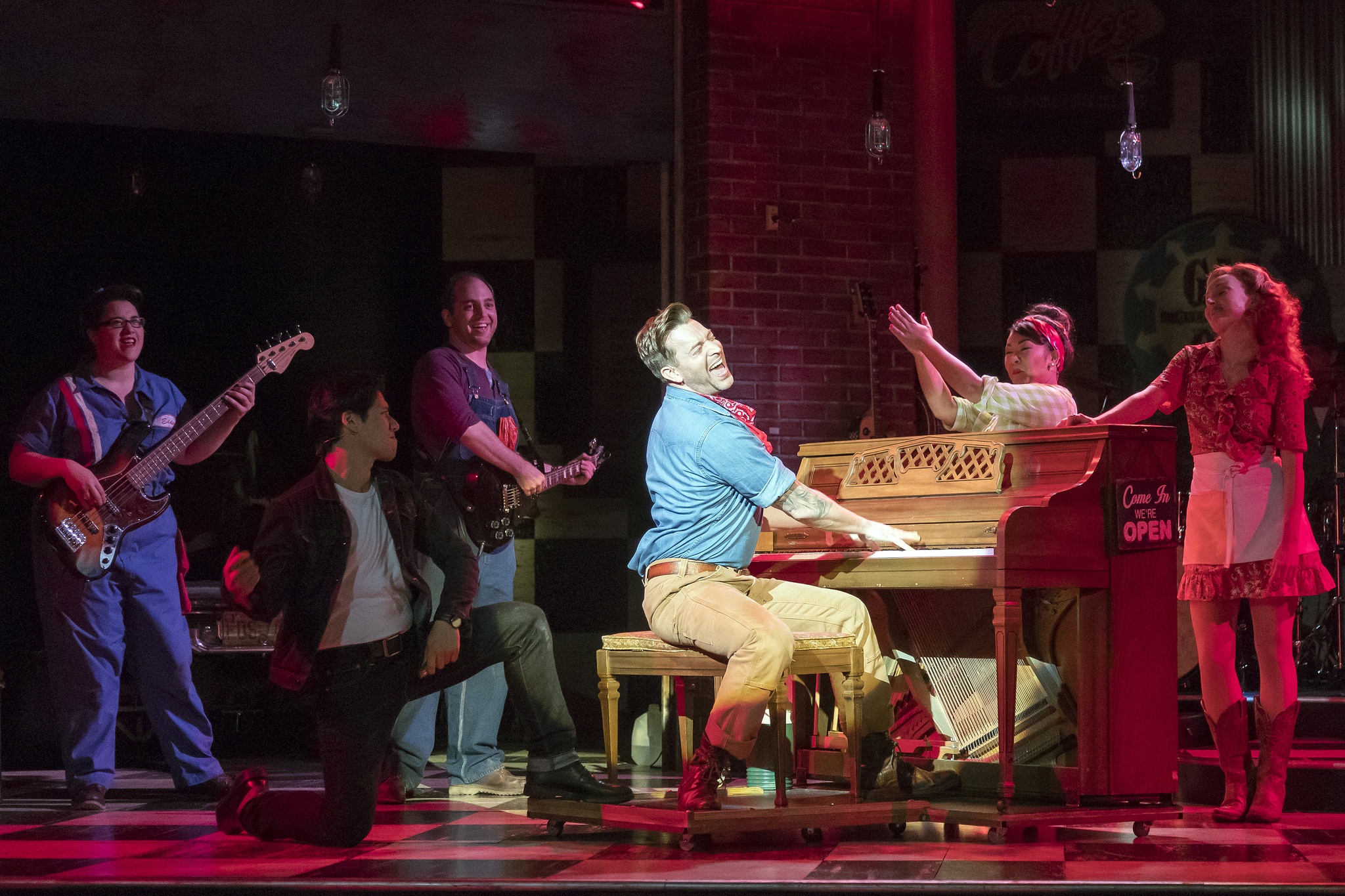 The cast of "Pump Boys and Dinettes" with Tony-winner Levi Kreis impressively rocking out on the piano. Photo courtesy of Pump Boys and Dinettes Production