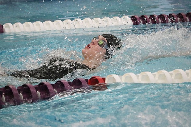 Skyline’s Sarah DiMeco competes in the 100 back during the KingCo girls swimming championship finals on Oct. 30 at Kamiak High School. Skyline