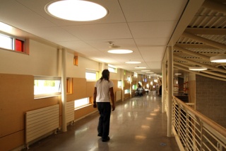 A worker walks down the upstairs hall at the new Rachel Carson Elementary School in Sammamish. Construction workers