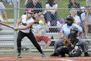 Eastlake’s Kimi Pohlman connects with a pitch last Friday against Redmond. Pohlman was 3-for-4 with two RBI.