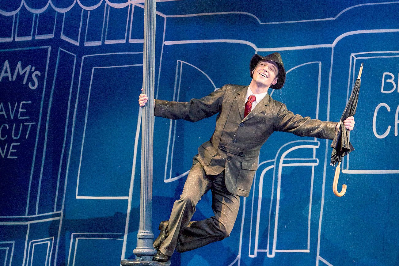 Get out the galoshes! “Singin’ in the Rain” splashes into Village Theatre