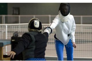 Instructor Kevin Mar and 12-year-old Lauren Poulson spar during a fencing class at the Issaquah Community Center last week. For more pictures and a column about fencing
