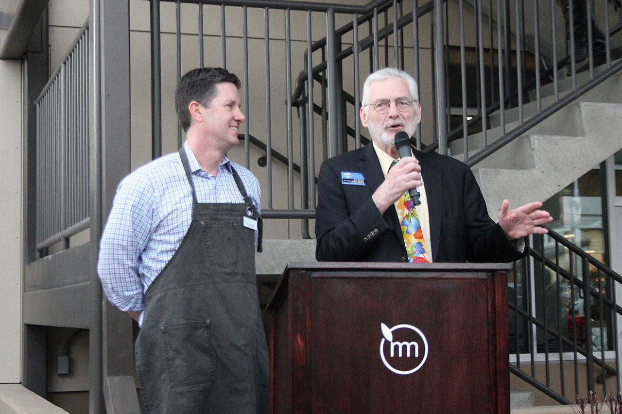 Alongside Metropolitan Market President and CEO Todd Korman, Sammamish Mayor Don Gerend, right, addresses the crowd gathered for the opening of Metropolitan Market in Sammamish on Wednesday (Joe Livarchik/staff photo).