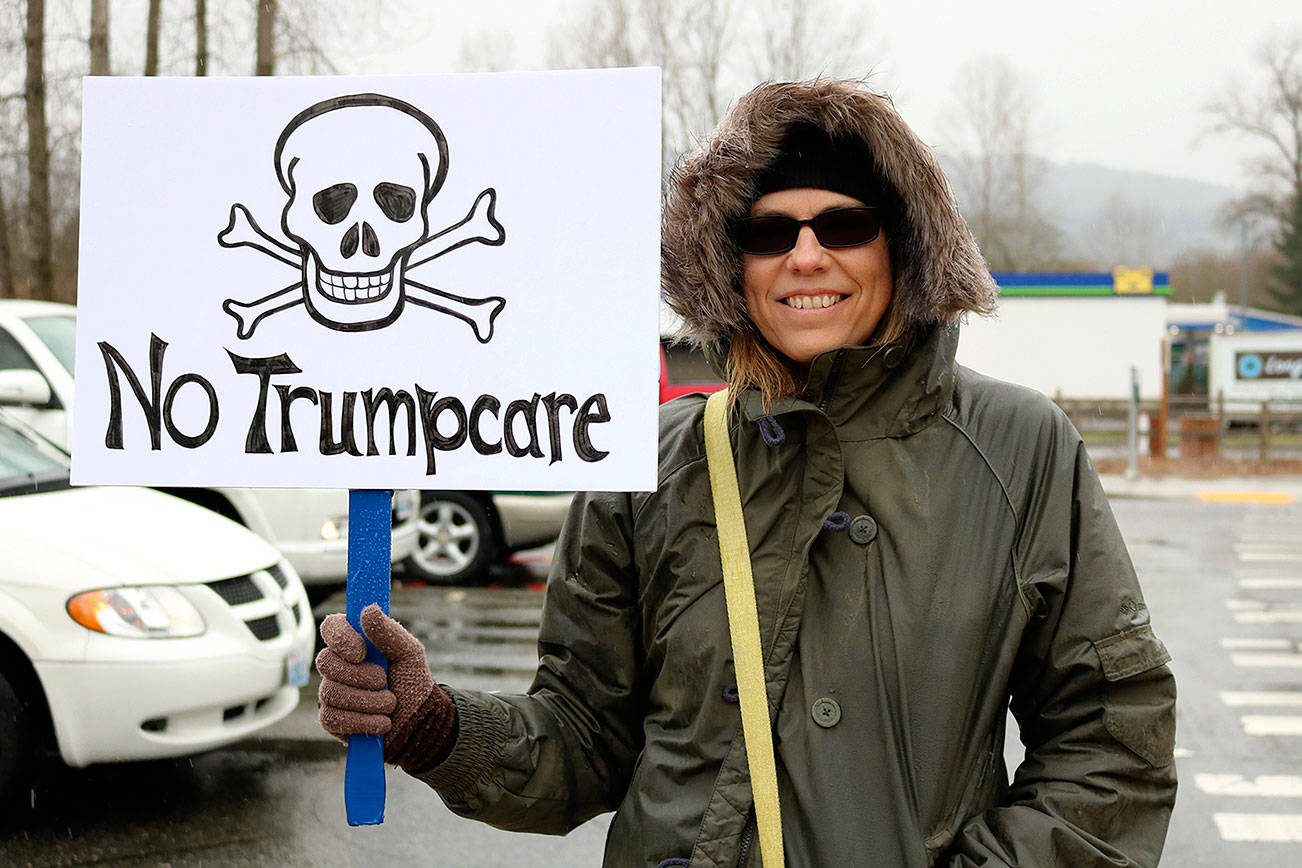 Protesters urge Reichert to oppose ‘Trumpcare’ at Issaquah rally