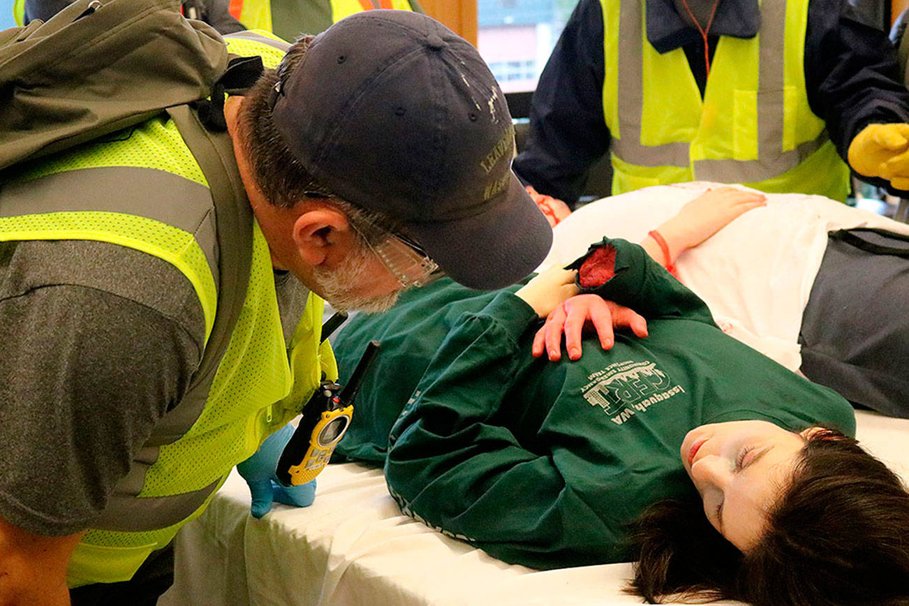 Dress rehearsal for the 9.0 — CERT class members demonstrate acquired skills in disaster simulation