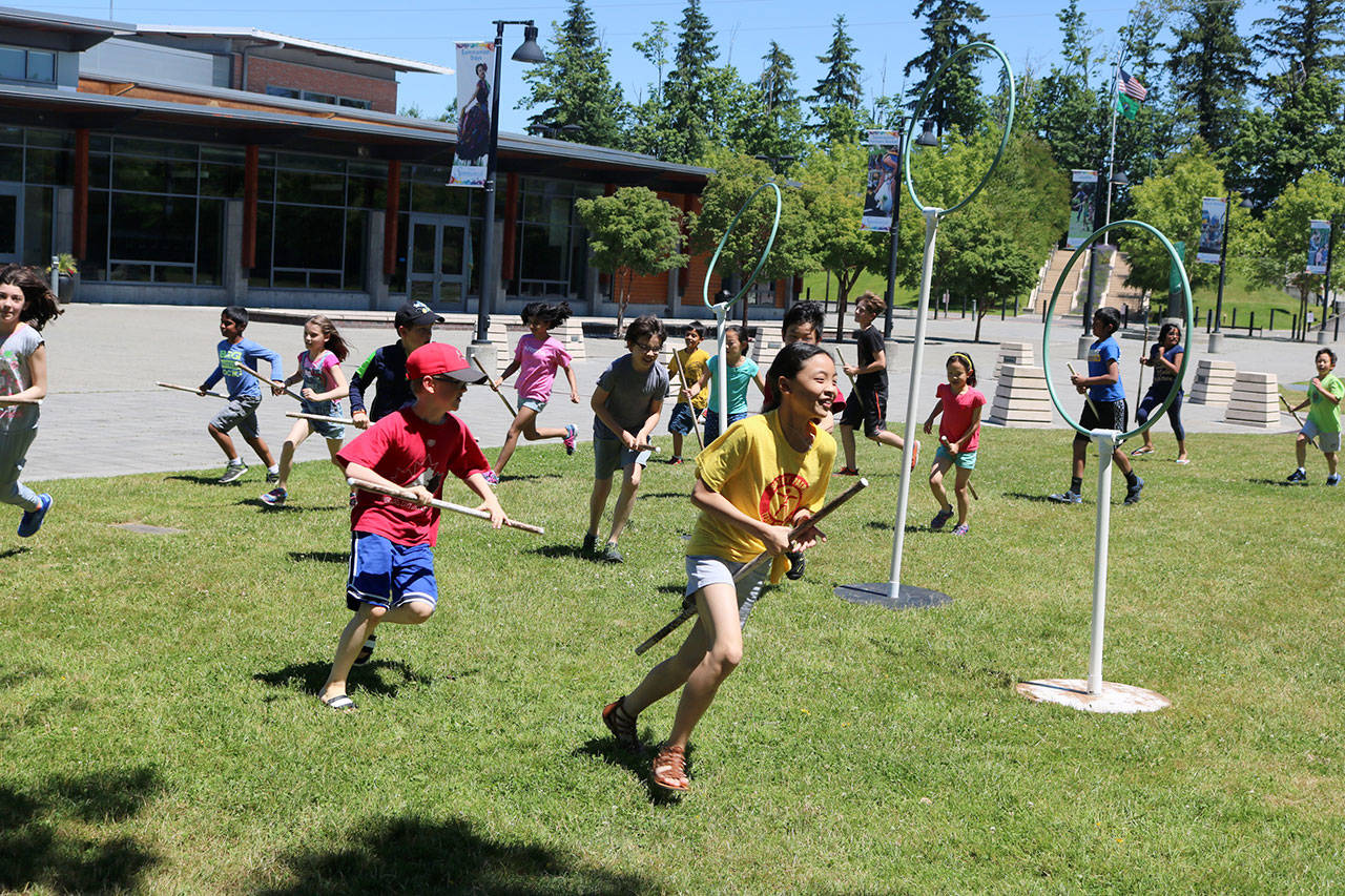 Nearly 20 Sammamish youngsters, ages 9-12, came out Saturday for the Sammamish Library’s Harry Potter book club and joined in a game of Quidditch, the famous sport in J.K.Rowling’s magical world. Megan Campbell/staff photo