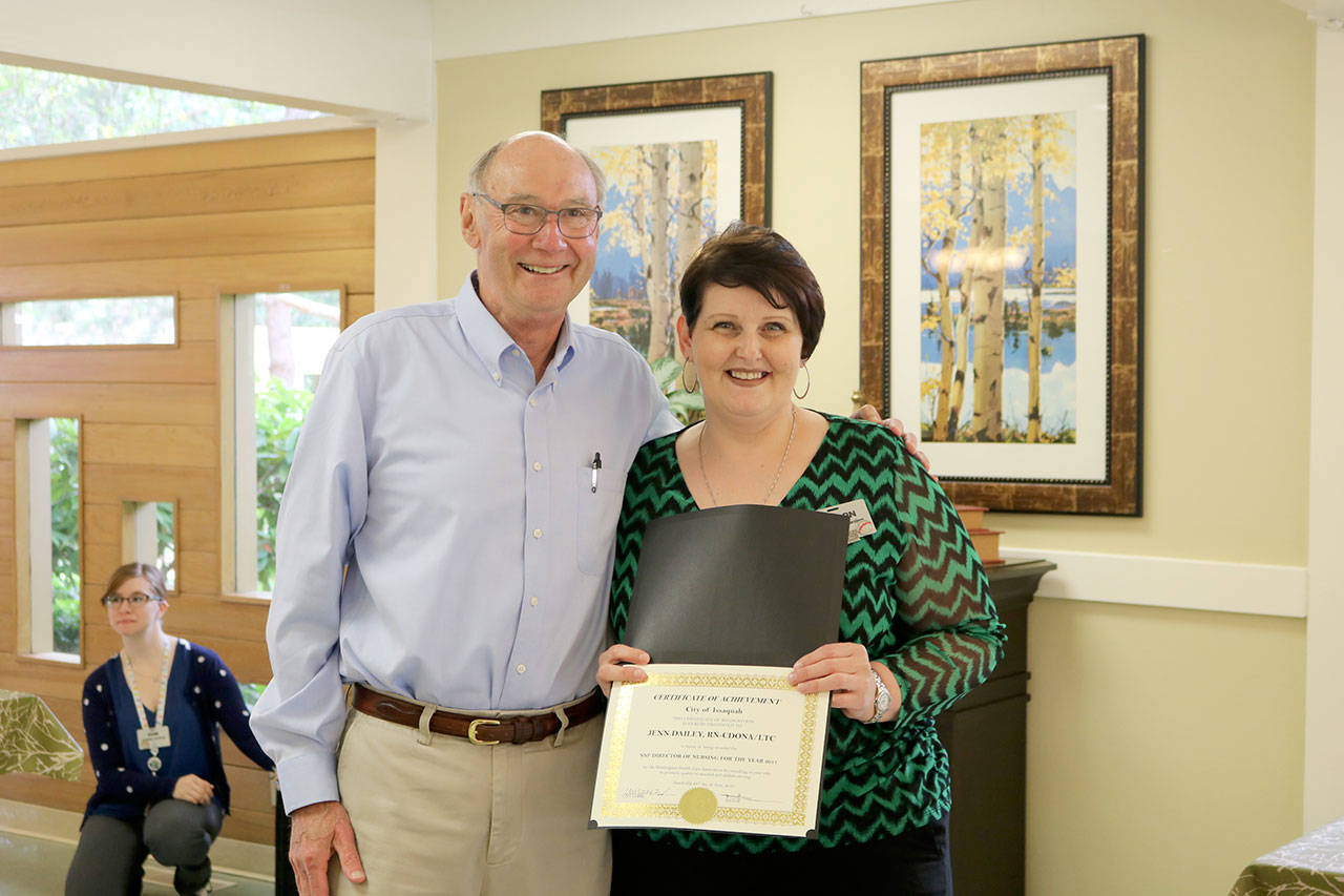 Jennifer Daily accepts her certificate from Mayor butler. (Evan Pappas/Staff Photo)