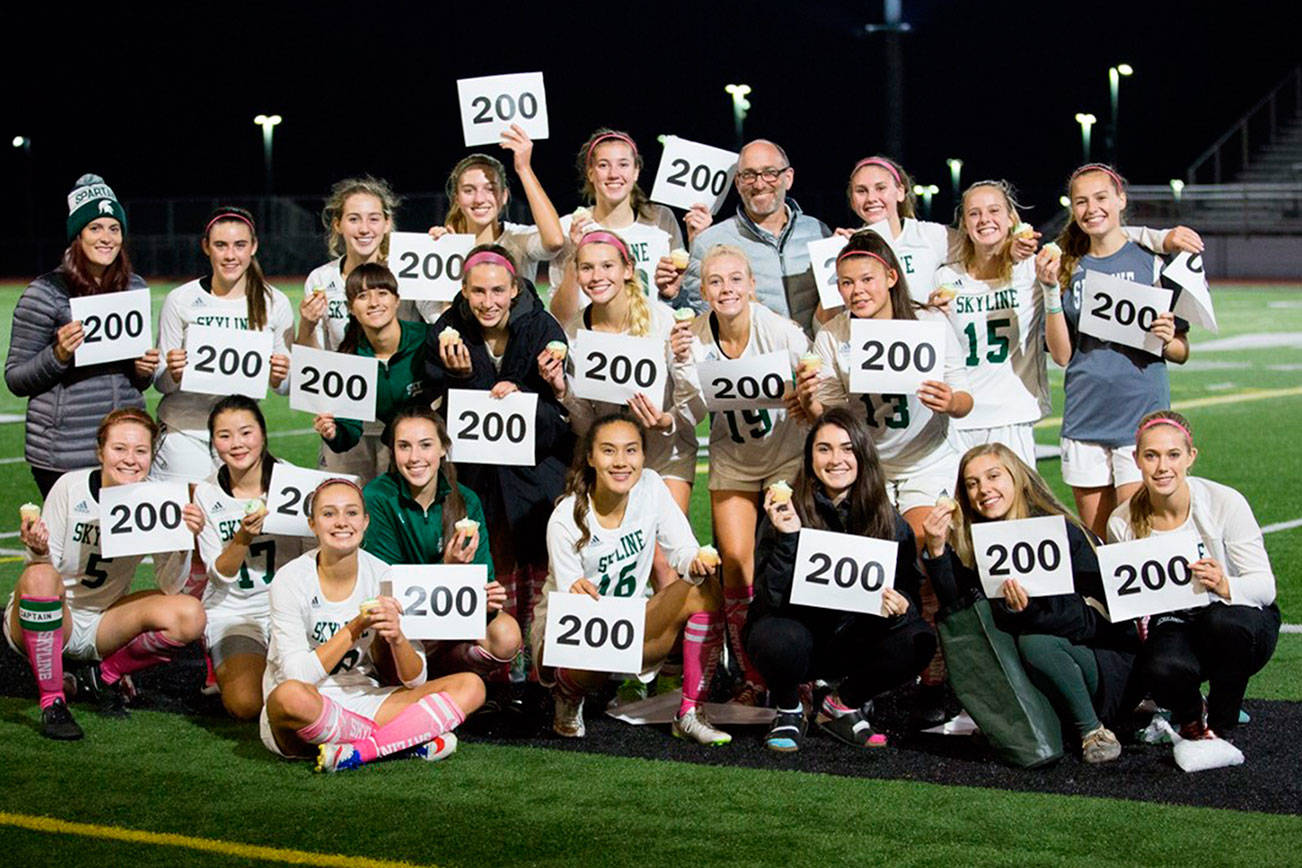 Photo courtesy of Dave Mitchell                                Skyline Spartans girls soccer head coach Don Braman attained a coveted milestone on the soccer field courtesy of his team’s 3-0 victory against the Newport Knights on Oct. 5 in Sammamish. The triumph was Braman’s 200th career win as head coach of the Spartans girls soccer program. Skyline players Daniella Roni (17th minute), Clare Wate (37th minute) and Saskia Slater (71st minute) each scored a goal apiece in the win against Newport. Spartans’ players Alison Kremer, Julia Mitchell and Maddie Butz each had an assist in the game as well. Skyline currently has an overall record of 9-1.