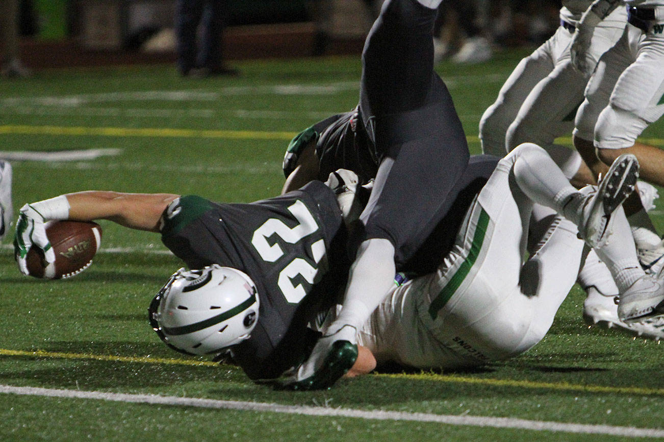 Photo courtesy of Jim Nicholson                                The Woodinville Falcons defeated the Skyline Spartans 38-20 in a Class 4A KingCo football contest on Oct. 20. Skyline, who had a four-game winning streak coming into the contest, dropped to 5-3 overall with the loss. Skyline receiver Nathan Brandt (pictured) dove for the endzone against the Falcons on Oct. 20. The Spartans will face the Issaquah Eagles in the 2017 regular season finale at 7 p.m. on Oct. 27 at Gary Moore Stadium in Issaquah.