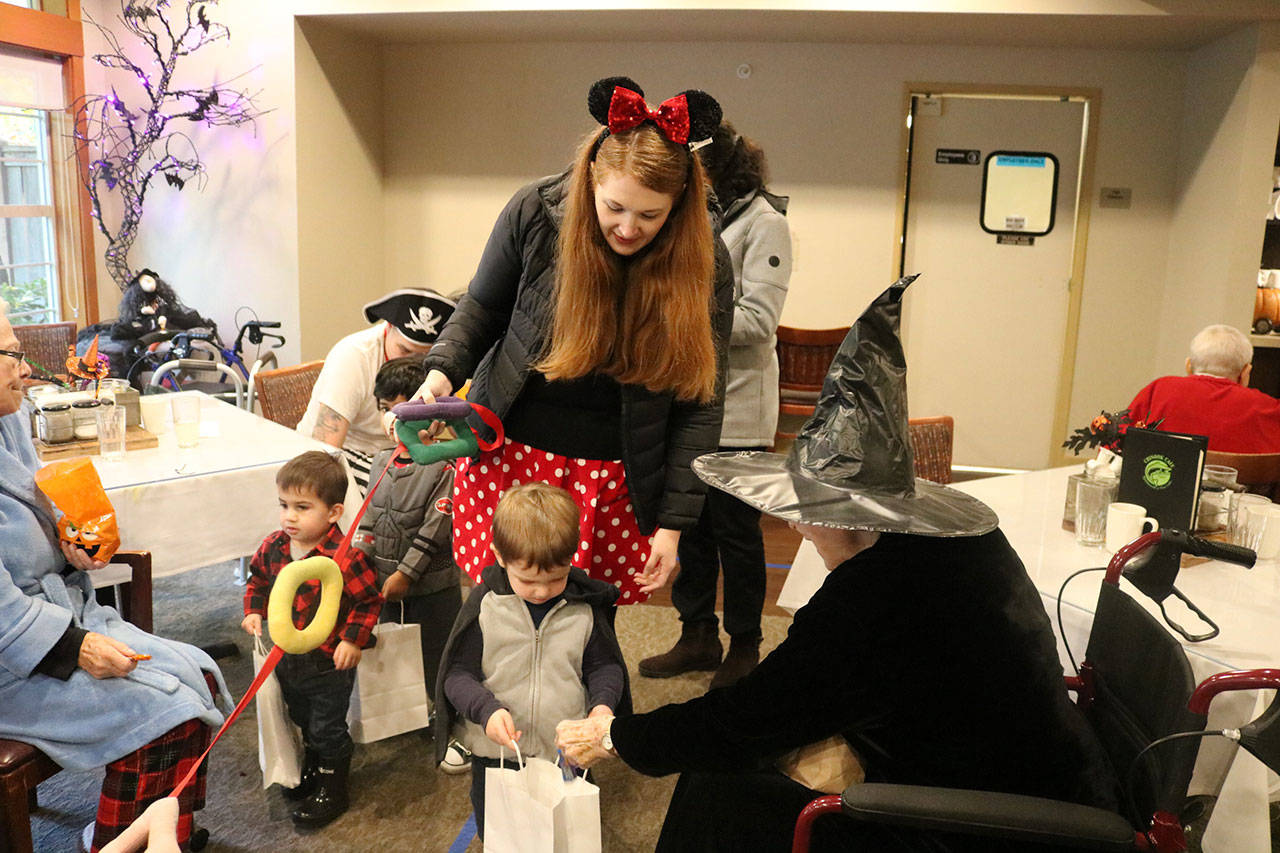 Evergreen Academy tots trick-or-treat with Spiritwood residents | Photos