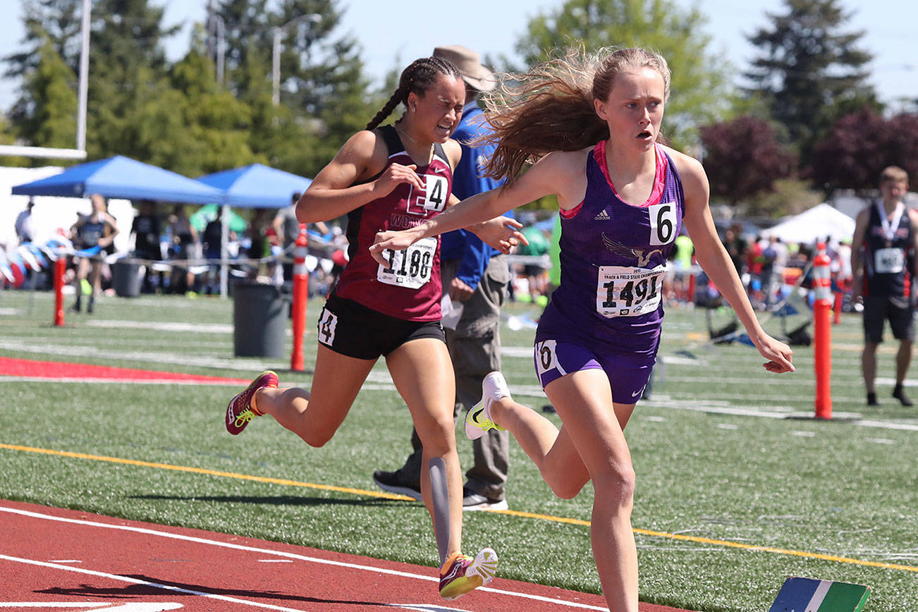 Photo courtesy of Don Borin/Stop Action Photography                                Eastlake Wolves senior Brooke Manson, left, will run track at the University of Utah. Manson captured second place in the Class 4A state track meet 800-meter run this past May.