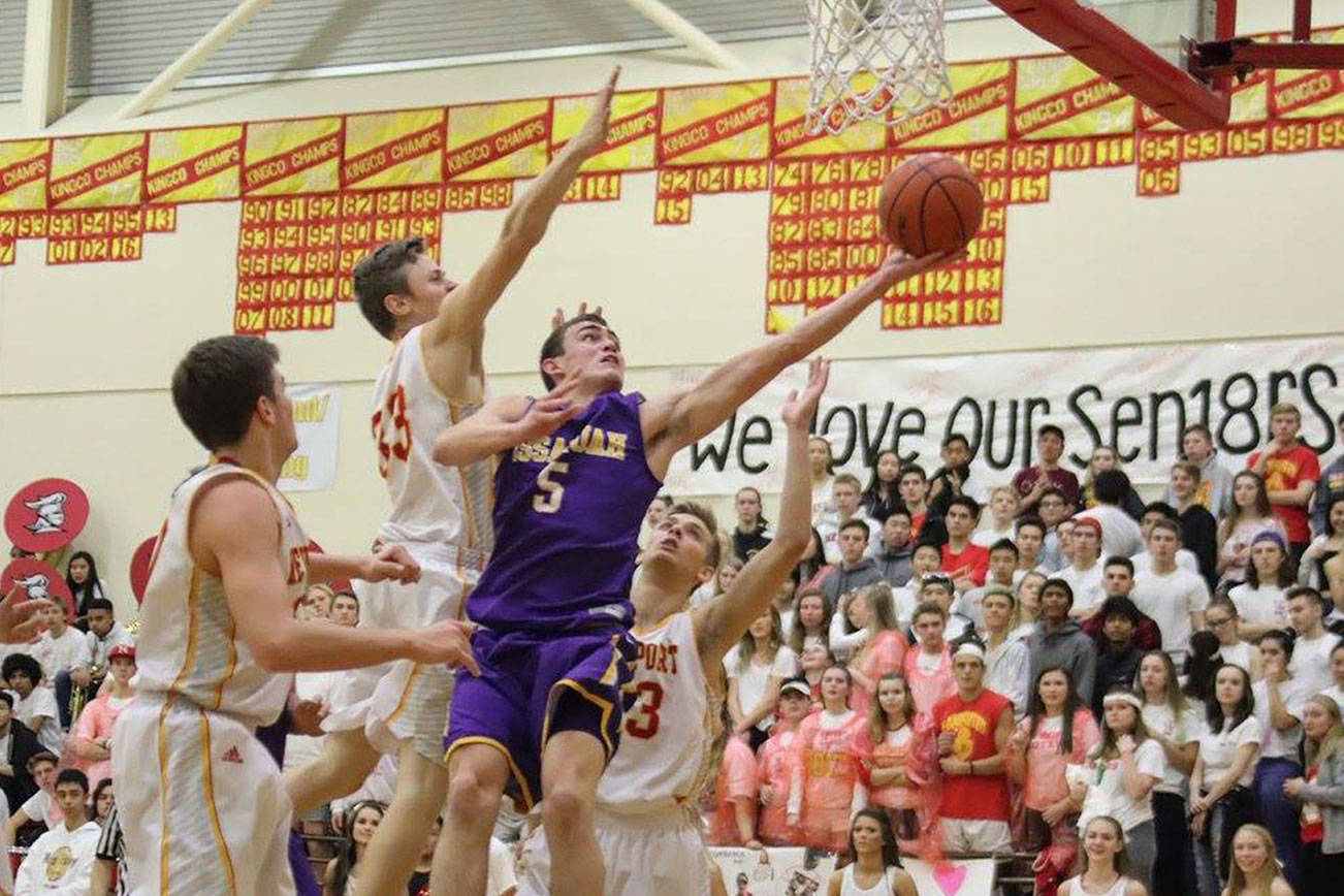 Photo courtesy of Don Borin/Stop Action Photography                                Issaquah Eagles senior guard Cam Roorda (No. 5) maneuvers around the Newport defense for a basket on Jan. 26 at Newport High School in Factoria. Newport defeated Issaquah 56-38.