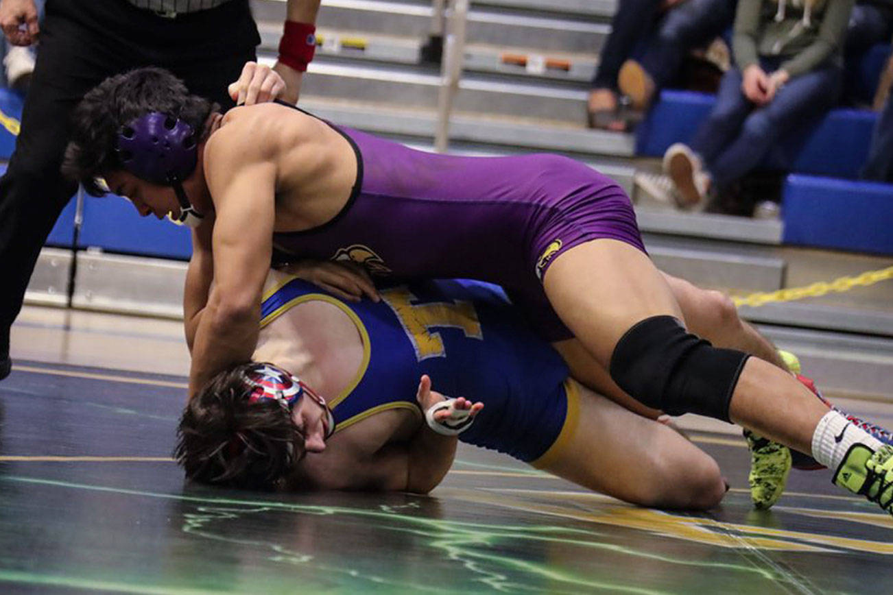 Photo courtesy of Don Borin/Stop Action Photography                                Issaquah senior wrestler Kaleb Solusod (pictured) registered a 7-4 victory against Tahoma grappler Max Repenn in the 170-pound championship match at the Class 4A Region II tournament at Tahoma High School in Maple Valley on Feb. 10. Solusod will face Nathan Carnicle (Sumner) in the first round of the Mat Classic Class 4A state tournament 170-pound weight division on Feb. 16 at the Tacoma Dome.