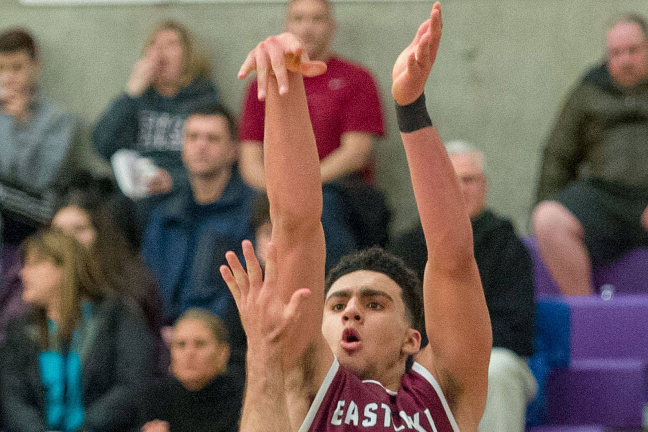 Photo courtesy of Patrick Krohn/Patrick Krohn Photography                                Skyline senior forward Evan Alexander, left, tries to block Eastlake junior Yousef Elkugia. Skyline earned a 55-54 win against the Eastlake Wolves in a loser-out, KingCo 4A playoff matchup on Feb. 15.