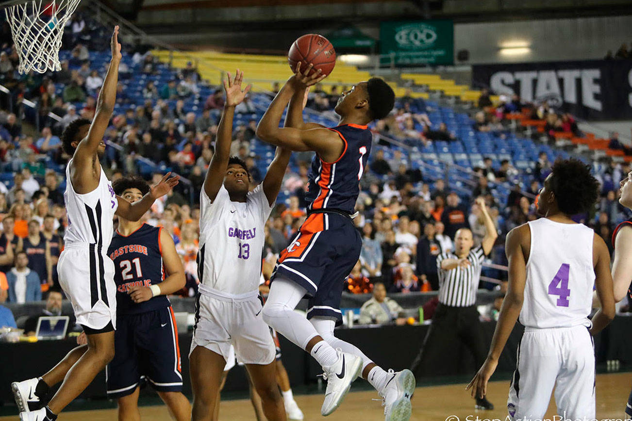 Photo courtesy of Don Borin/Stop Action Photography                                Eastside Catholic Crusaders guard Shane Nowell drives to the hoop against the Garfield Bulldogs in the Class 3A state semifinals on March 2 at the Tacoma Dome. Garfield earned a 56-48 victory against Eastside Catholic.