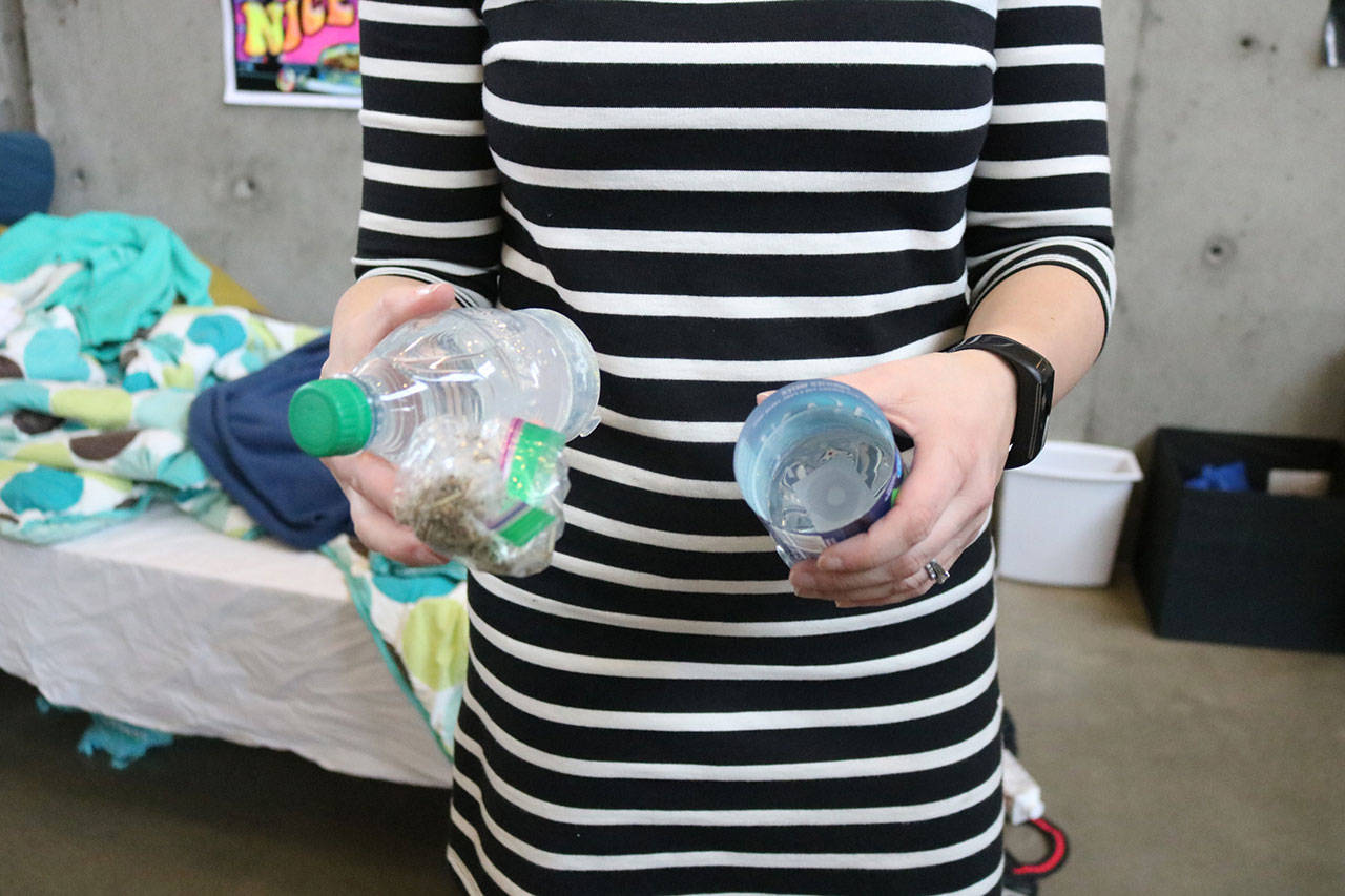 Moeller shows how a water bottle can be taken apart to hide marijuana. Nicole Jennings/staff photo