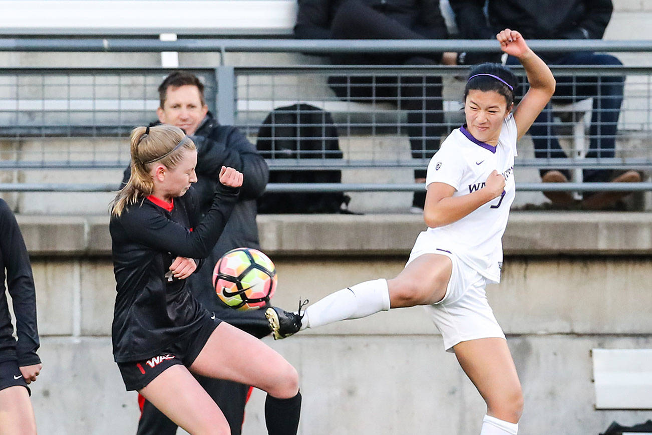 Photo courtesy of Rick Edelman/Rick Edelman Photography                                Issaquah High School 2017 graduate Kaylene Pang (pictured on right), who will be a sophomore defender on the University of Washington Huskies women’s soccer team when it opens up regular season action this fall, competes against Seattle University in a spring game on April 12 in Seattle. Pang made 10 appearances off of the bench during her freshman season in 2017.