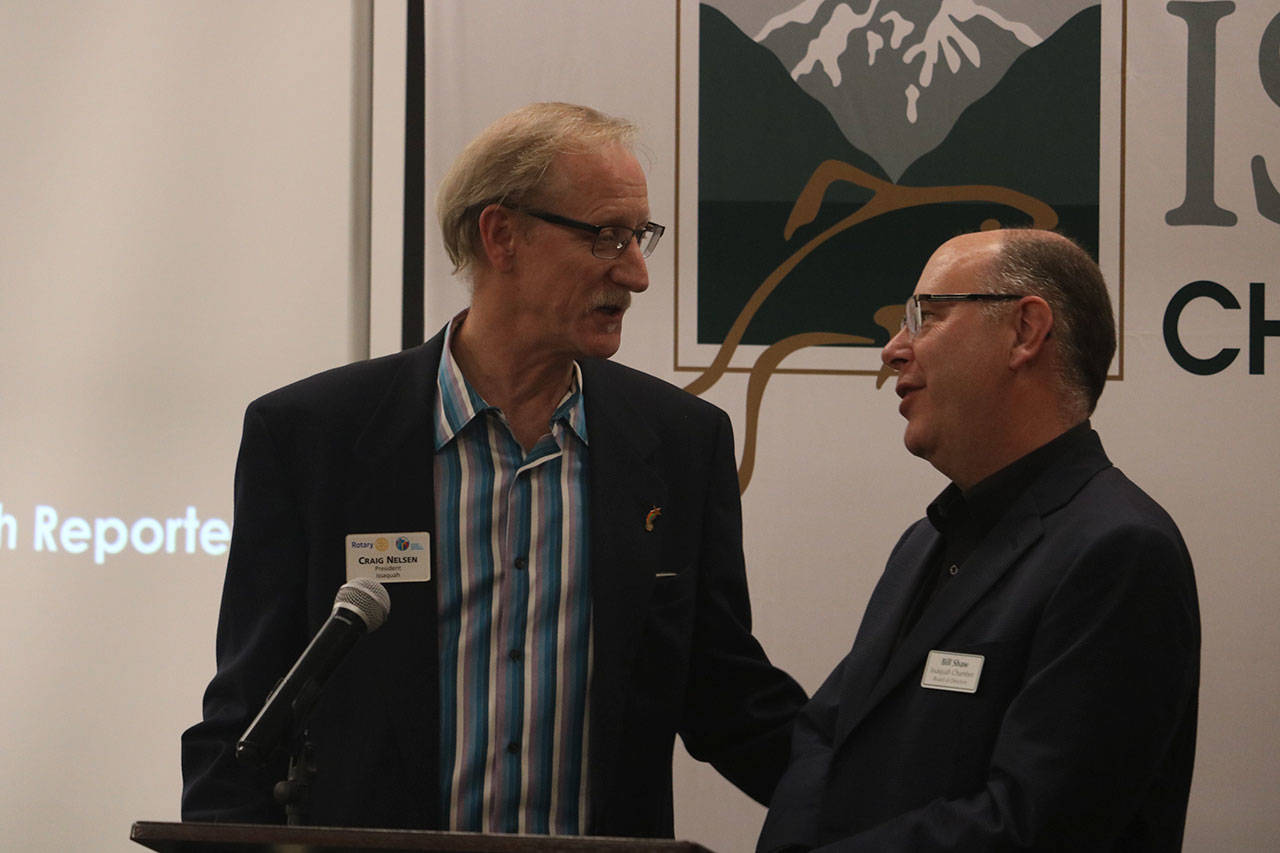 Craig Nelson, left, president of the Rotary Club of Issaquah, accepted the inaugural Ed Pingul Award on behalf of Fred Nystrom who was unable to be at the banquet. Aaron Kunkler/Staff photo