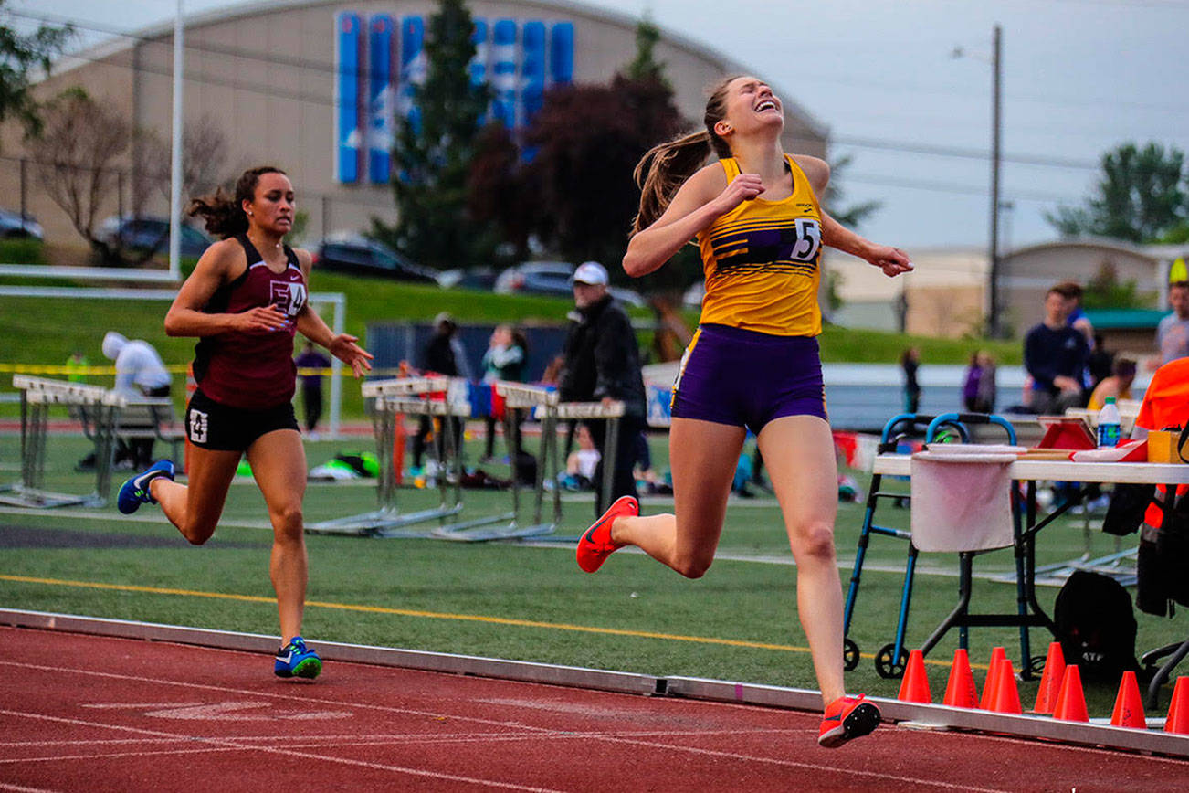 Photo courtesy of Don Borin/Stop Action Photography                                Issaquah Eagles senior Sami Corman, right, earned first place with a time of 2:08.55 in the 800 at the Class 4A District II track championships on May 18 at the Southwest Athletic Complex in Seattle. Eastlake senior Brooke Manson, left, captured second place with a time of 2:09.43.