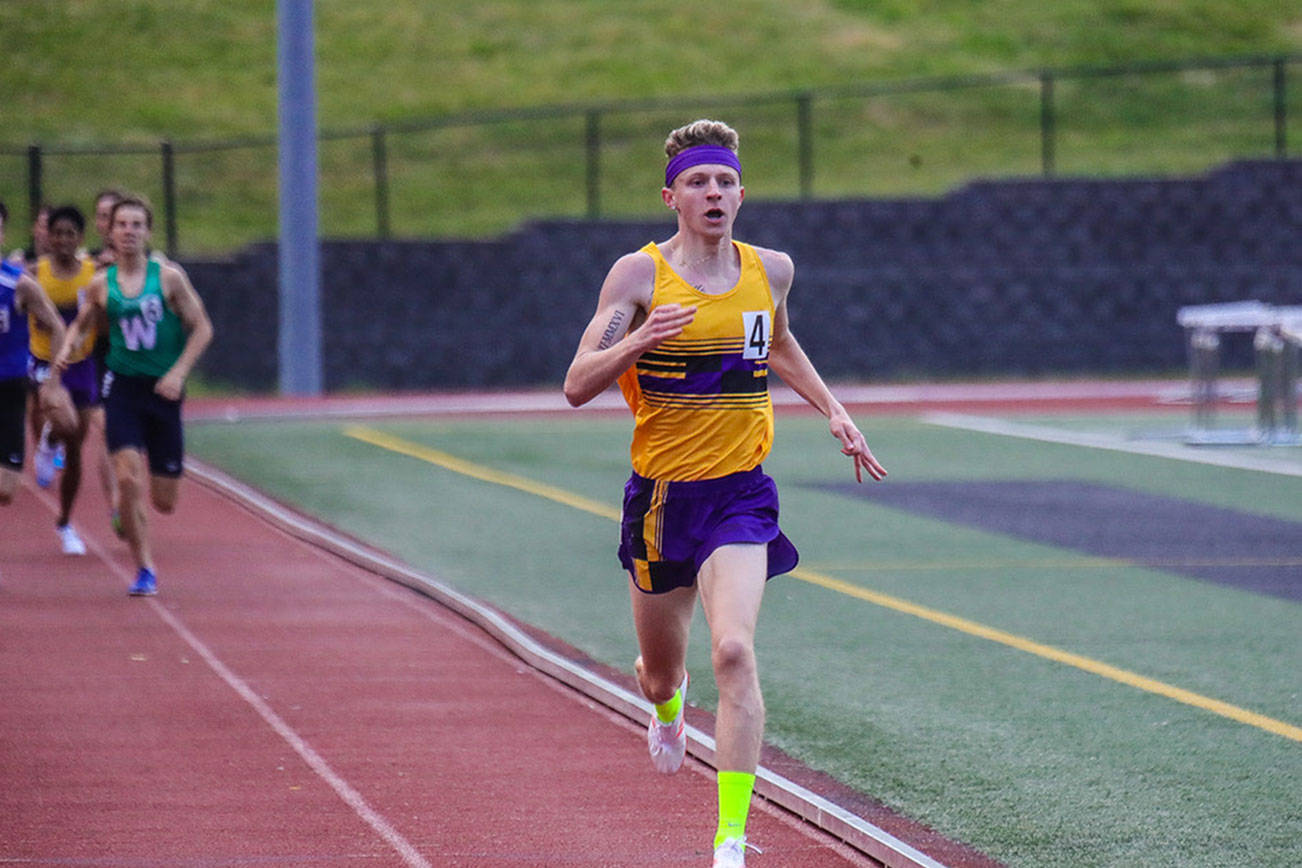Photo courtesy of Don Borin/Stop Action Photography                                Issaquah Eagles senior Luke George earned first place with ease turning in a time of 1:53.34 in the 800 at Class 4A District II track championships on May 18 at the Southwest Athletic Complex in Seattle.                                George finished significantly ahead of the other competitors in the event. Bothell’s Brandon Simmons finished in second placewith a time of 1:57.7.