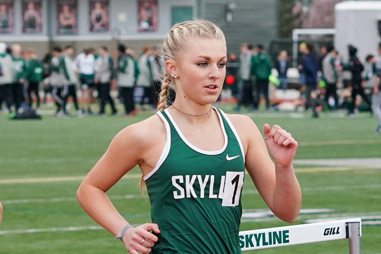 Skyline Spartans senior Amber McGraw, right, competes in an event during the 2018 track season. McGraw will run cross country and track at Seattle Pacific University during the 2018-19 school year.                                Photo courtesy of Tedesco Photography