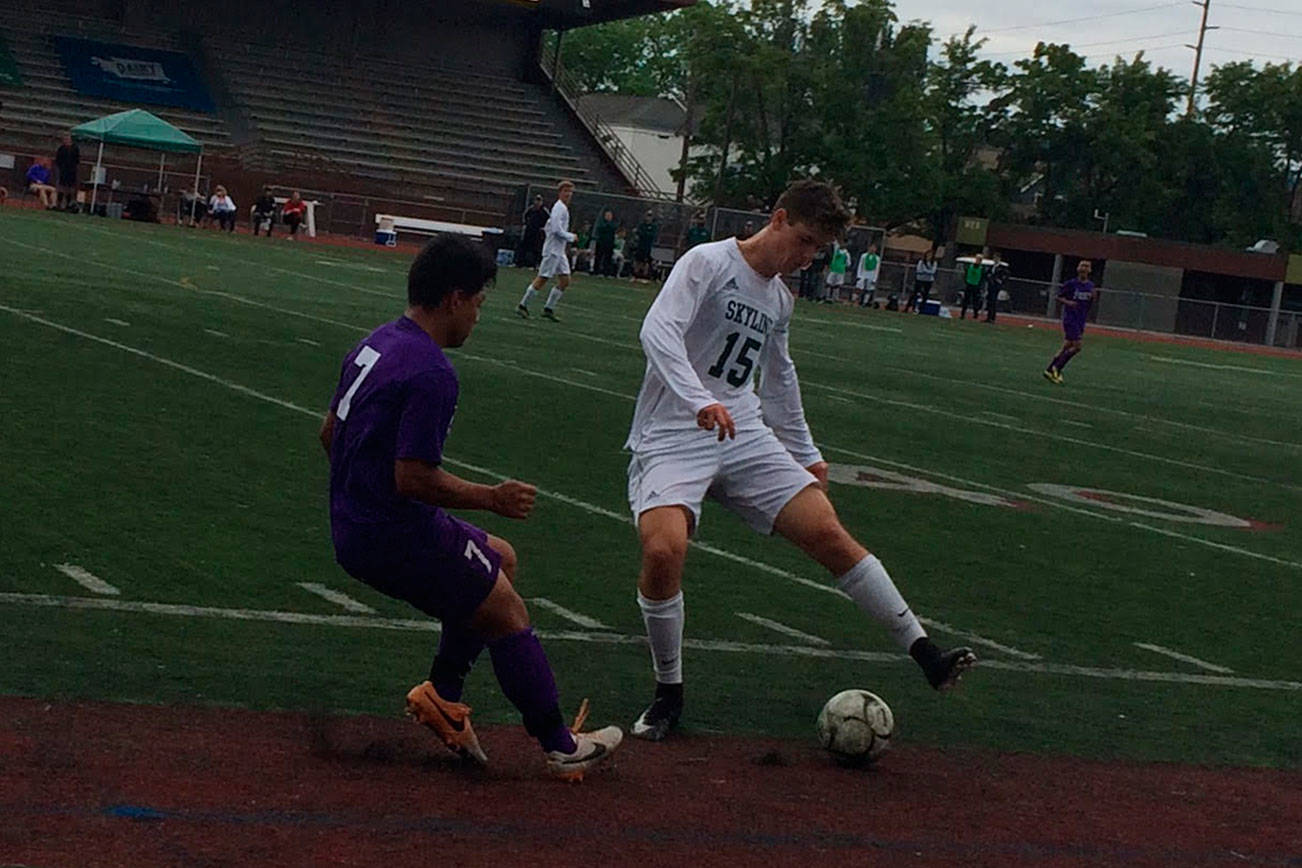 Shaun Scott, staff photo                                Skyline Spartans midfielder Dennis Bilginer, right, tries to maneuver around Pasco midfielder Kevin Meraz Rodriguez, left, in the first half of the Class 4A state soccer championship game on May 26 at Sparks Stadium in Puyallup. Pasco defeated Skyline 1-0 in overtime.