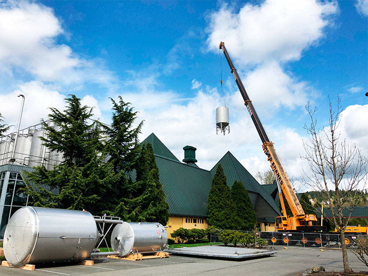 A crane removes beer brewing vats from the old Redhook brewery in Woodinville. Two wineries and the theater company Teatro ZinZanni are planning on moving into the space. Contributed by Keri Tawney