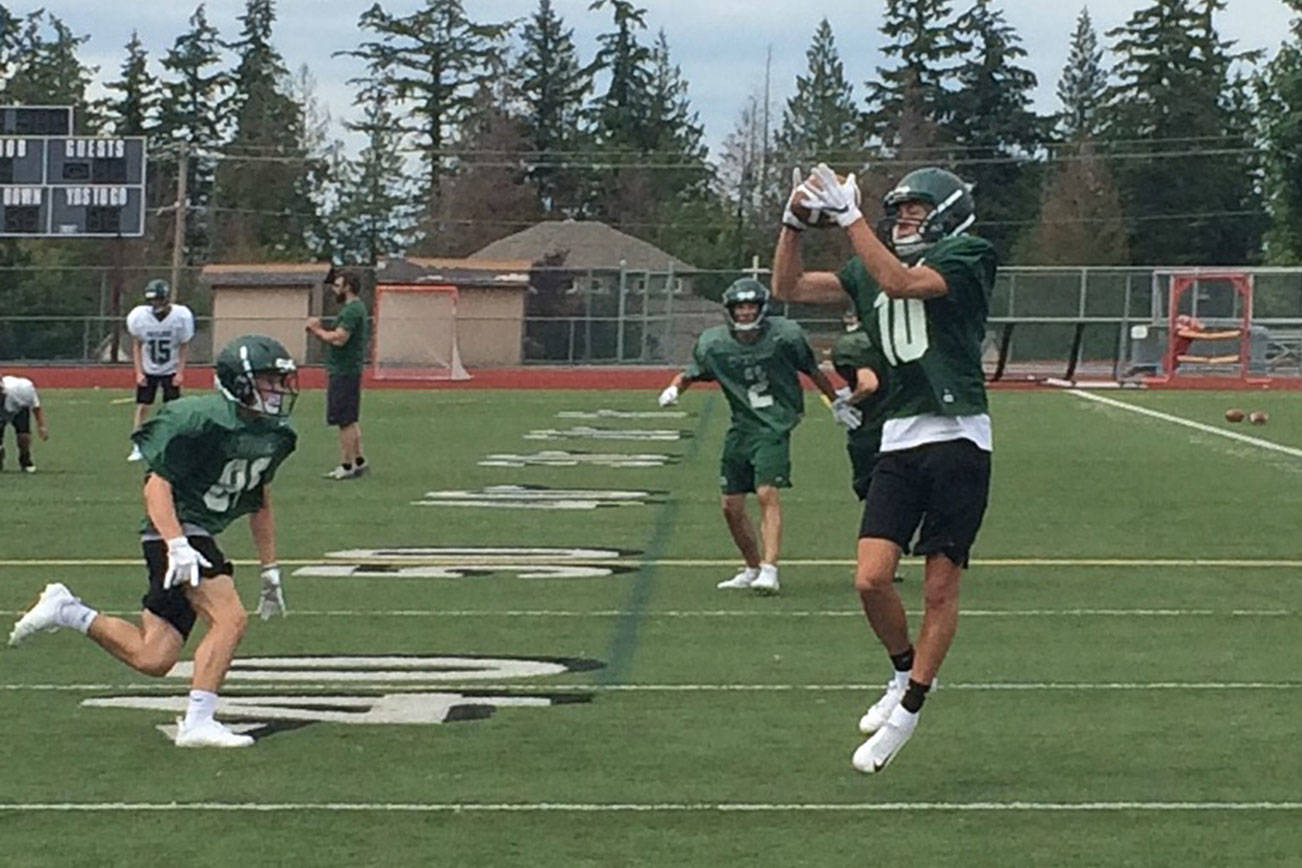 Skyline Spartans sophomore wide receiver Karl Herrmann hauls in a pass during a spring football practice session on June 12 at Skyline High School in Sammamish. Shaun Scott, staff photo