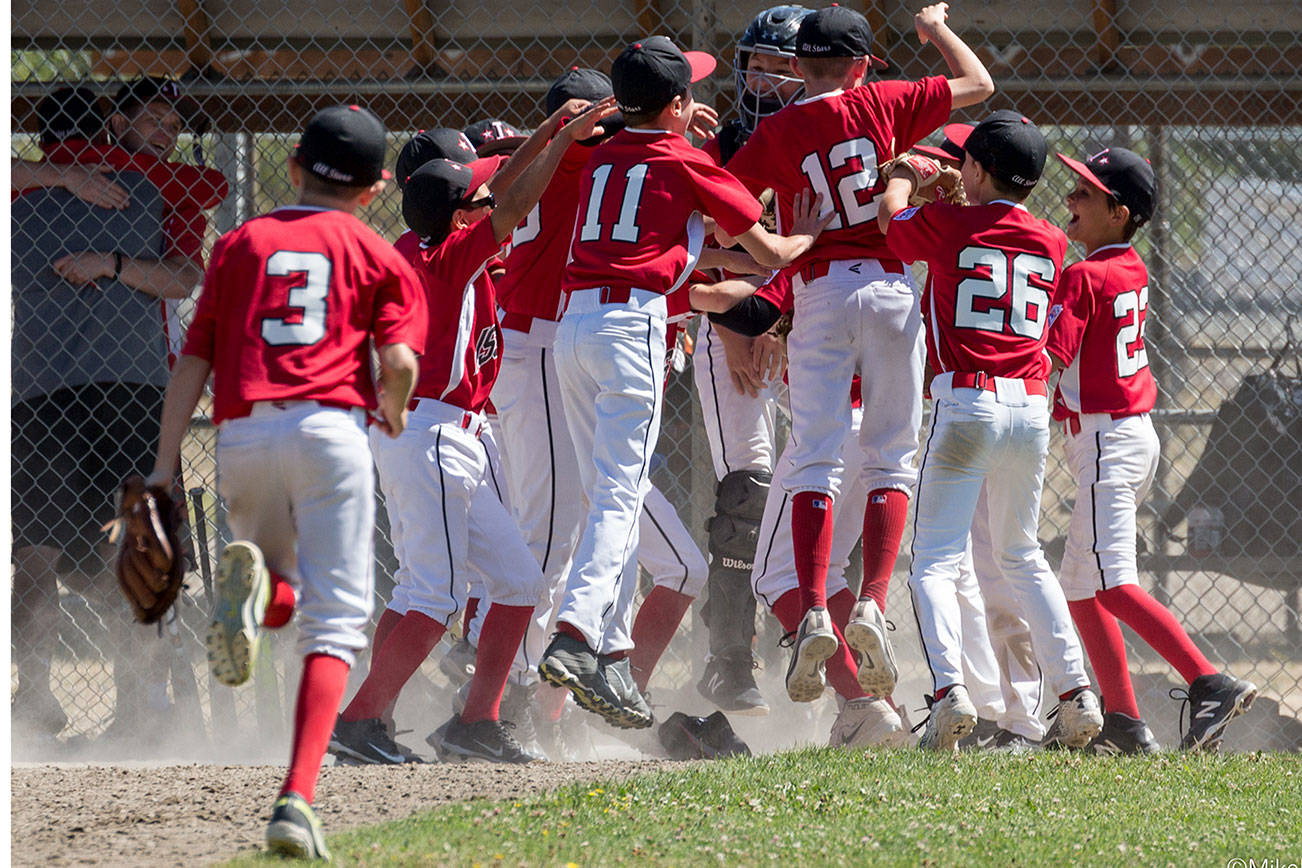 Members of the Issaquah Little League 11U all-star baseball team celebrate after winning the state championship on July 21 at PacWest Little League fields in SeaTac. Photo courtesy of Mike Leaird