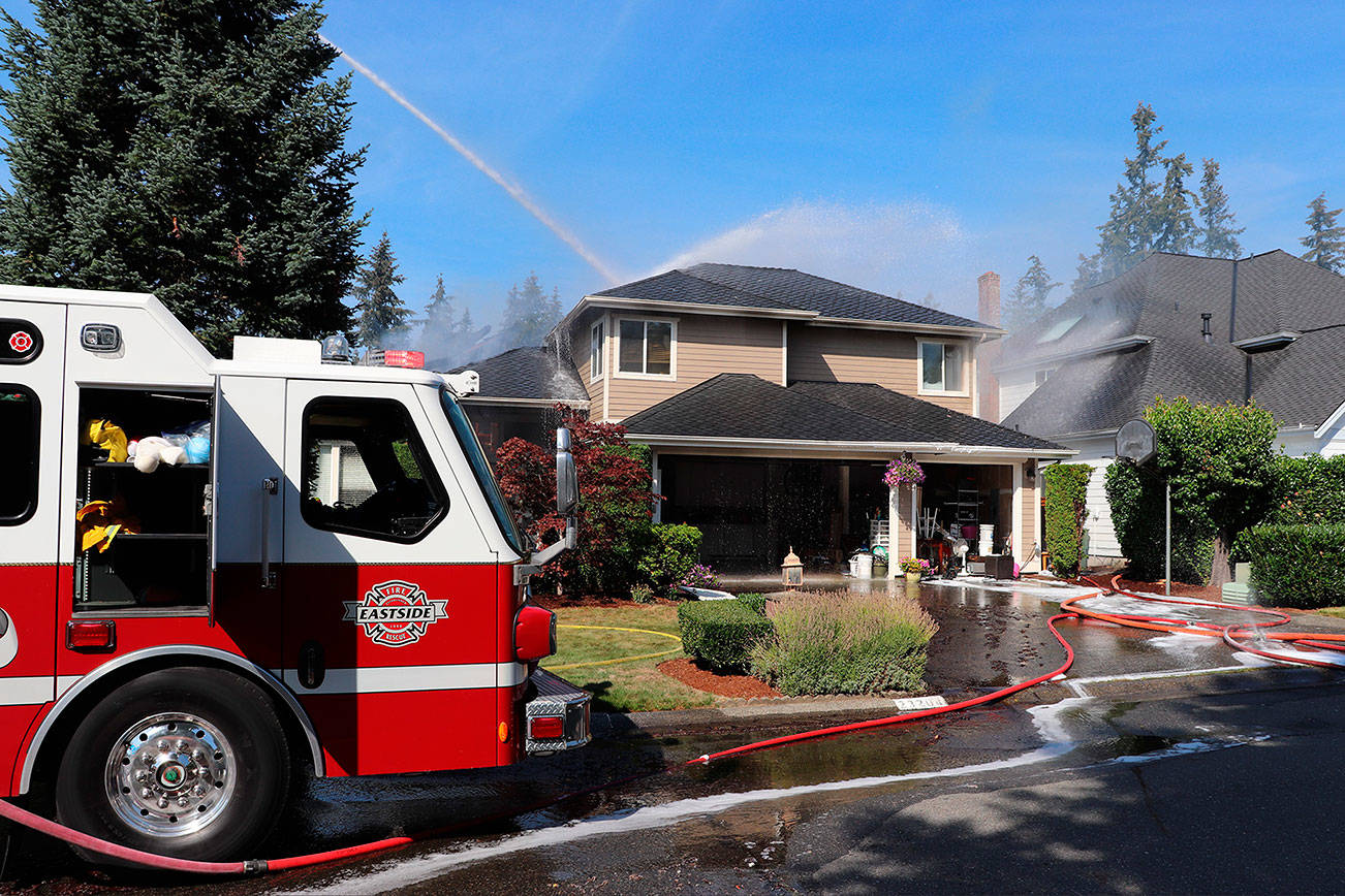 Eastside Fire & Rescue team up with Bothell and Redmond Firefighters to extinguish a house fire in Sammamish. Photo courtesy of Eastside Fire & Rescue